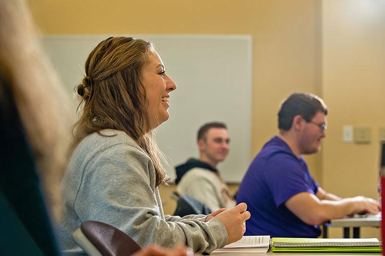 student smiling in classroom